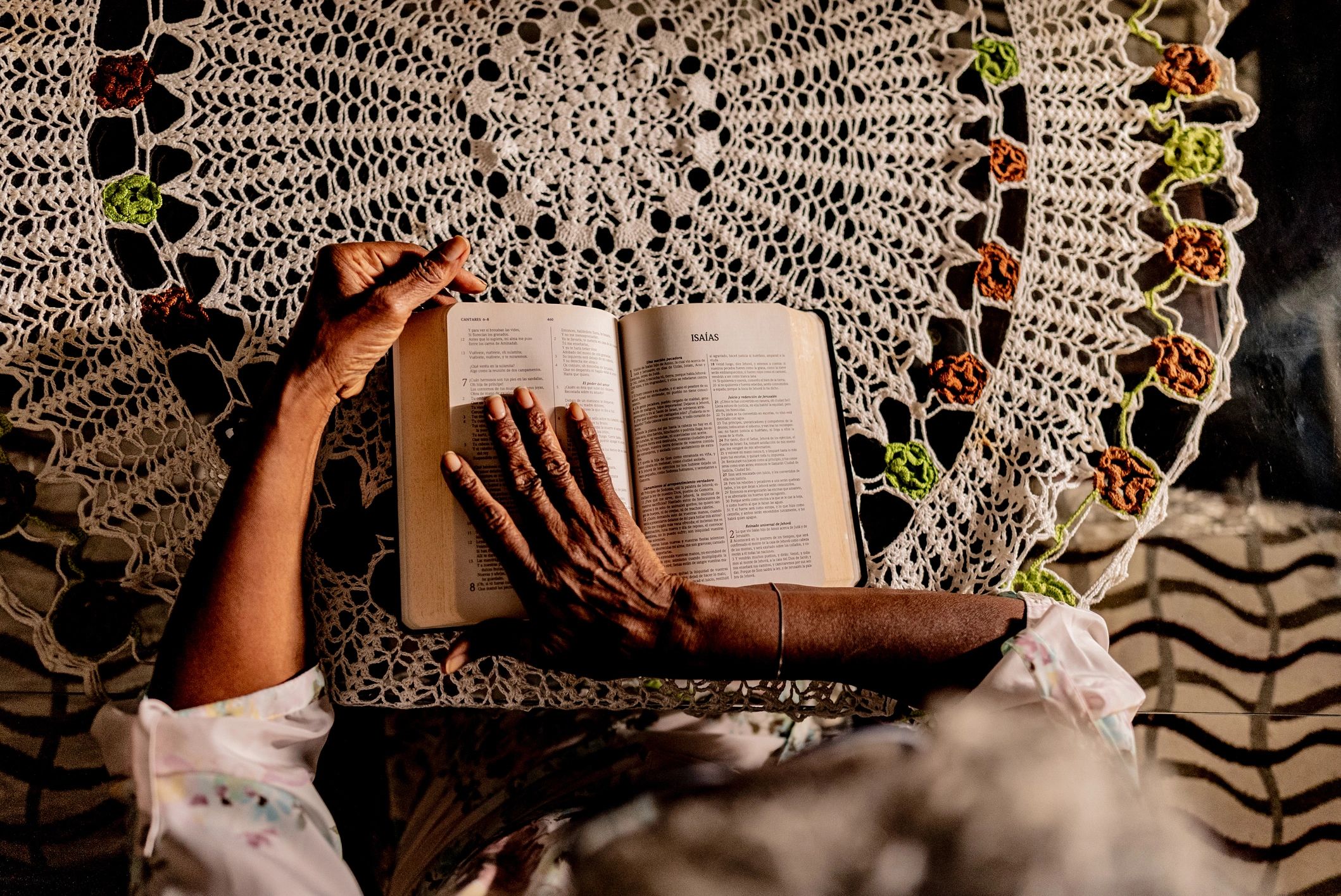 Close-up of woman reading the bible at home